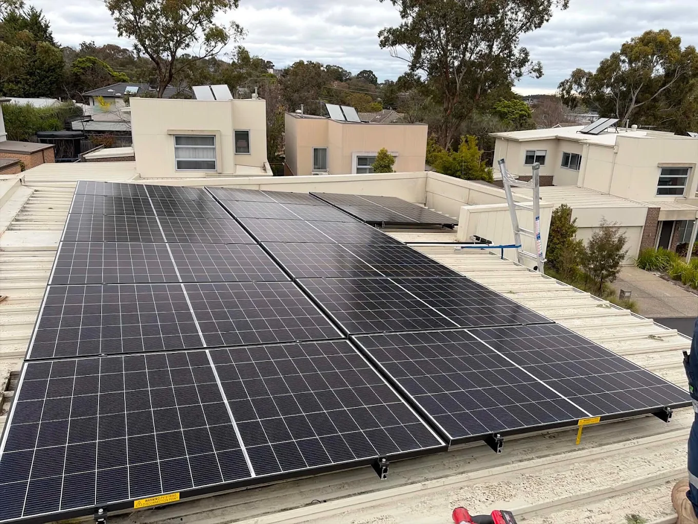 Rooftop solar panel array installed by R.A.W Electrical Group